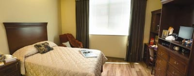 Cozy private room with a bed and desk