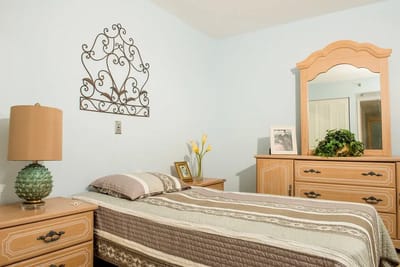 Interior view of a modest resident room with furniture