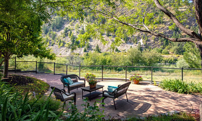Outdoor seating area with scenic view and flowers