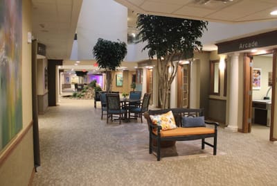 Common area with seating and decorative trees
