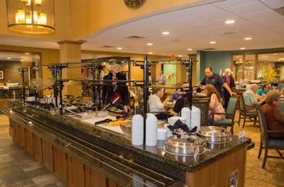 Residents enjoying a meal in the dining area