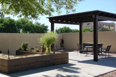 Outdoor patio area with seating and garden