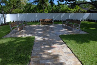 Patio area with benches in a landscaped garden