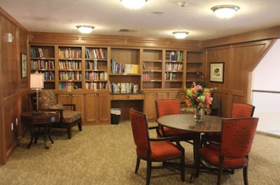 Cozy reading area with bookshelves and a table