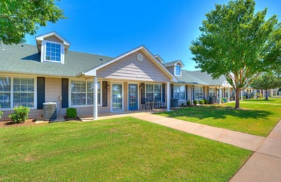 Exterior view of Silver Elm Estates with green lawn