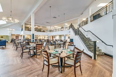 Bright dining room with tables and chairs setup