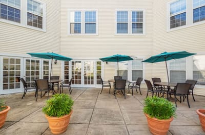 Outdoor patio area with tables and umbrellas
