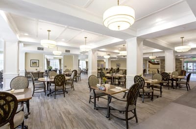 Bright dining room with tables set for meals