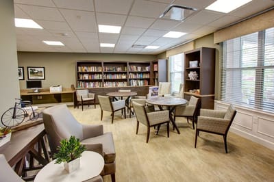 Cozy common area with bookshelves and seating