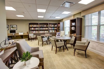 Bright common area with bookshelves and seating