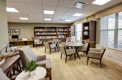 Cozy common area with seating and bookshelves