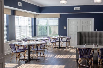 Bright dining area with tables and chairs