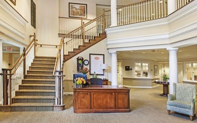 Lobby area with a welcoming staircase and reception desk
