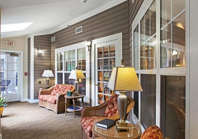 A cozy lounge area with comfortable seating and lamps