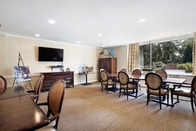 Bright common area with tables and chairs