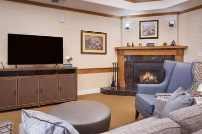 Cozy common area with a fireplace and seating