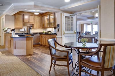 Bright interior common area with kitchen and dining space
