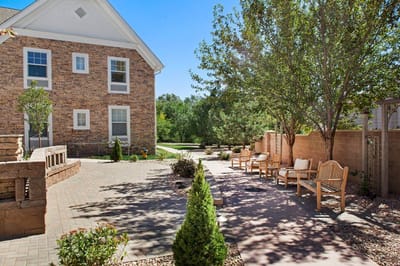 Outdoor space with seating and garden area.