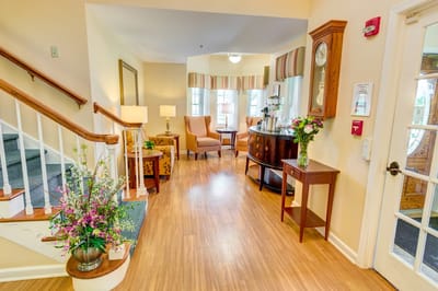 Bright interior common area with seating and flowers