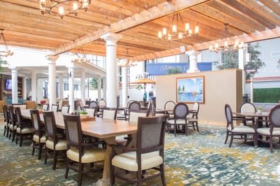 Bright dining area with wooden beams and elegant seating