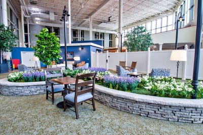 Interior view of a common area with seating and plants
