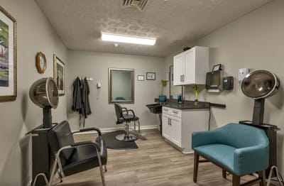 Beauty salon area with styling chairs and equipment