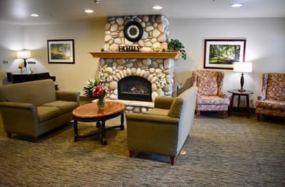 Cozy lobby with seating and fireplace