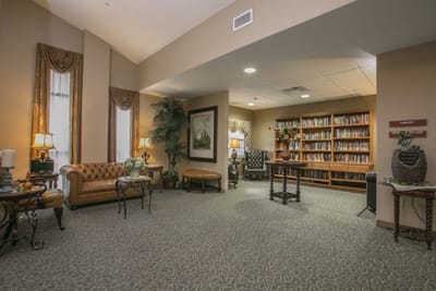 Cozy common area with seating and bookshelves