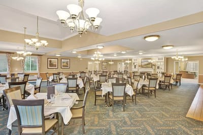 Dining room setup with tables and chairs
