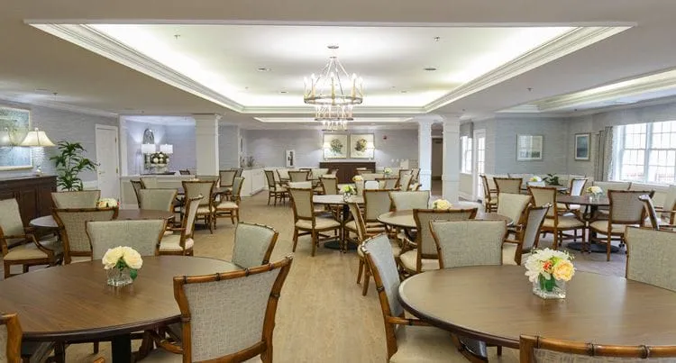 Dining room with tables and floral centerpieces