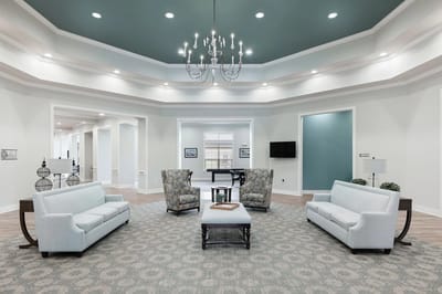 Interior common area with seating and chandelier
