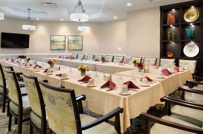Bright dining room setup with floral arrangements
