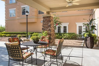 Outdoor seating area with tables and chairs