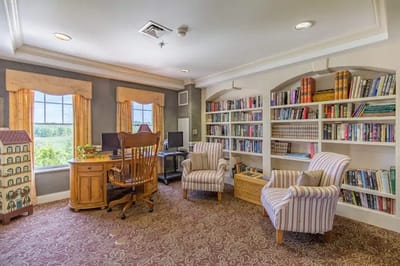 Comfortable interior lounge with bookshelves and seating