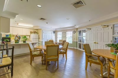 Bright common area with tables and chairs