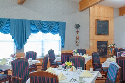 Dining room with tables set for meals