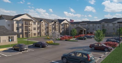 Exterior view of a senior living facility with parking