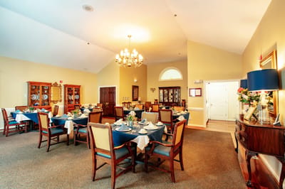 Cozy dining area with set tables and decorations