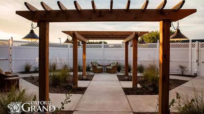 Outdoor seating area with pergola and lighting