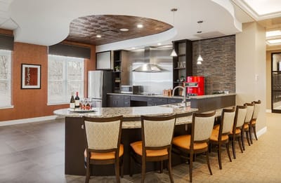 Bright and modern kitchen area with bar seating