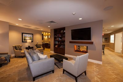 Cozy lounge area with comfortable seating and a fireplace