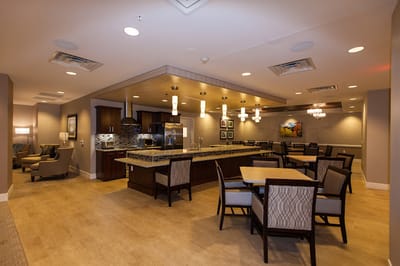 Interior dining area with tables and kitchen