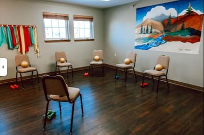 An interior activity room with exercise equipment
