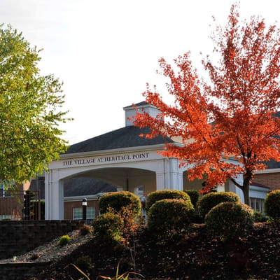 Exterior view of The Village at Heritage Point with autumn foliage