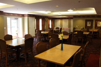 Dining room with tables and chairs, bright lighting