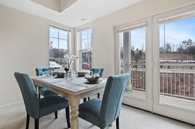 Bright dining area with a table set for meals