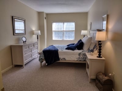 Cozy interior of a private resident room with a bed and decor
