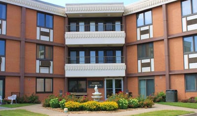 Exterior view of the nursing home building with gardens
