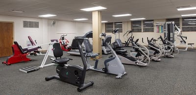 Interior view of a fitness room with exercise equipment