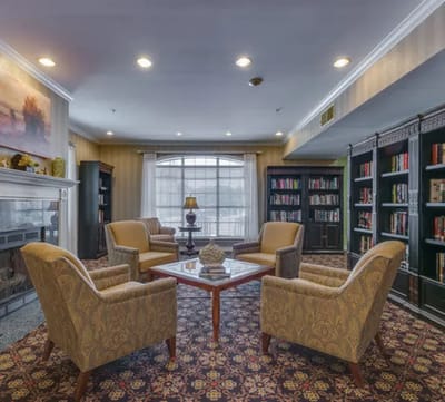 Comfortable lounge area with bookshelves and seating